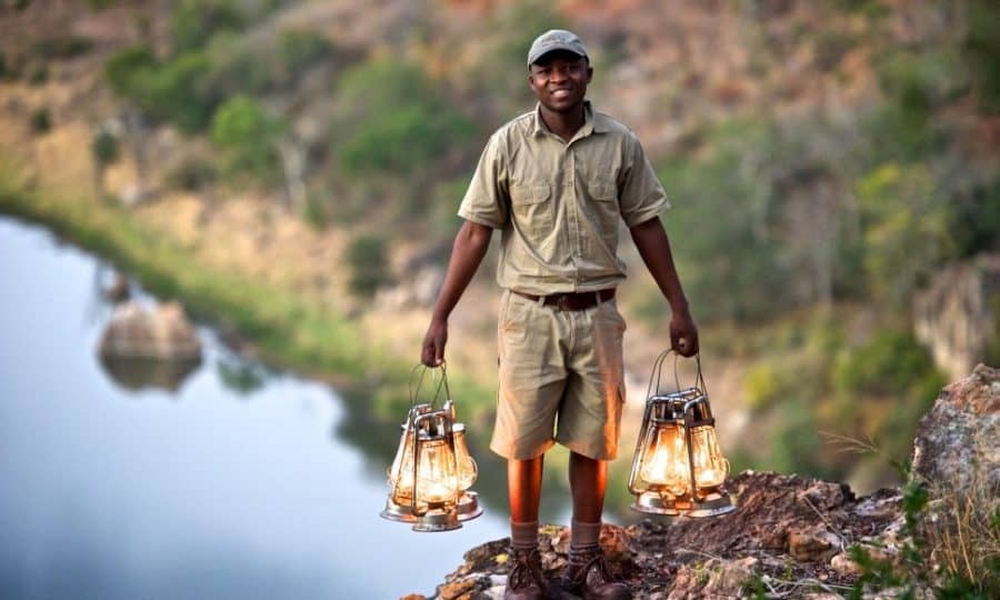 Zimbabwe man with lanterns