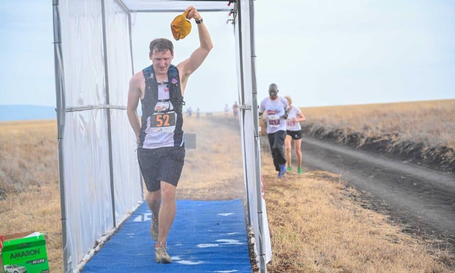 Runner at Lewa Safari Marathon 2023 walks through wash station