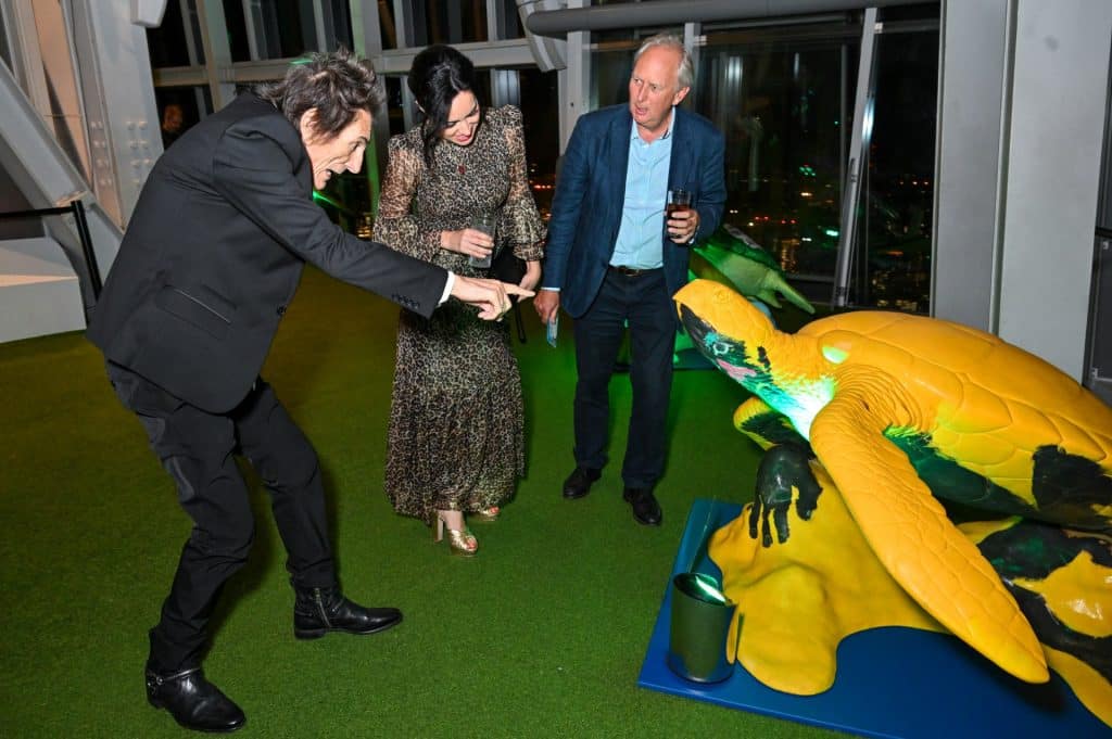 LONDON, ENGLAND - OCTOBER 08: (L to R) Ronnie Wood, Sally Wood and Charlie Mayhew attend the Tusk Turtle Trail Auction, raising money in aid of African Conservation, at The View from The Shard on October 8, 2025 in London, England. (Photo by Dave Benett/Getty Images for The View from The Shard &amp; Tusk)