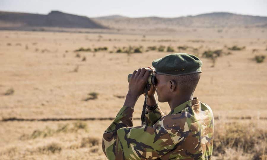 Tusk Trust - The Lewa Wildlife Conservancy Security ranger with binoculars © Frank Petersen